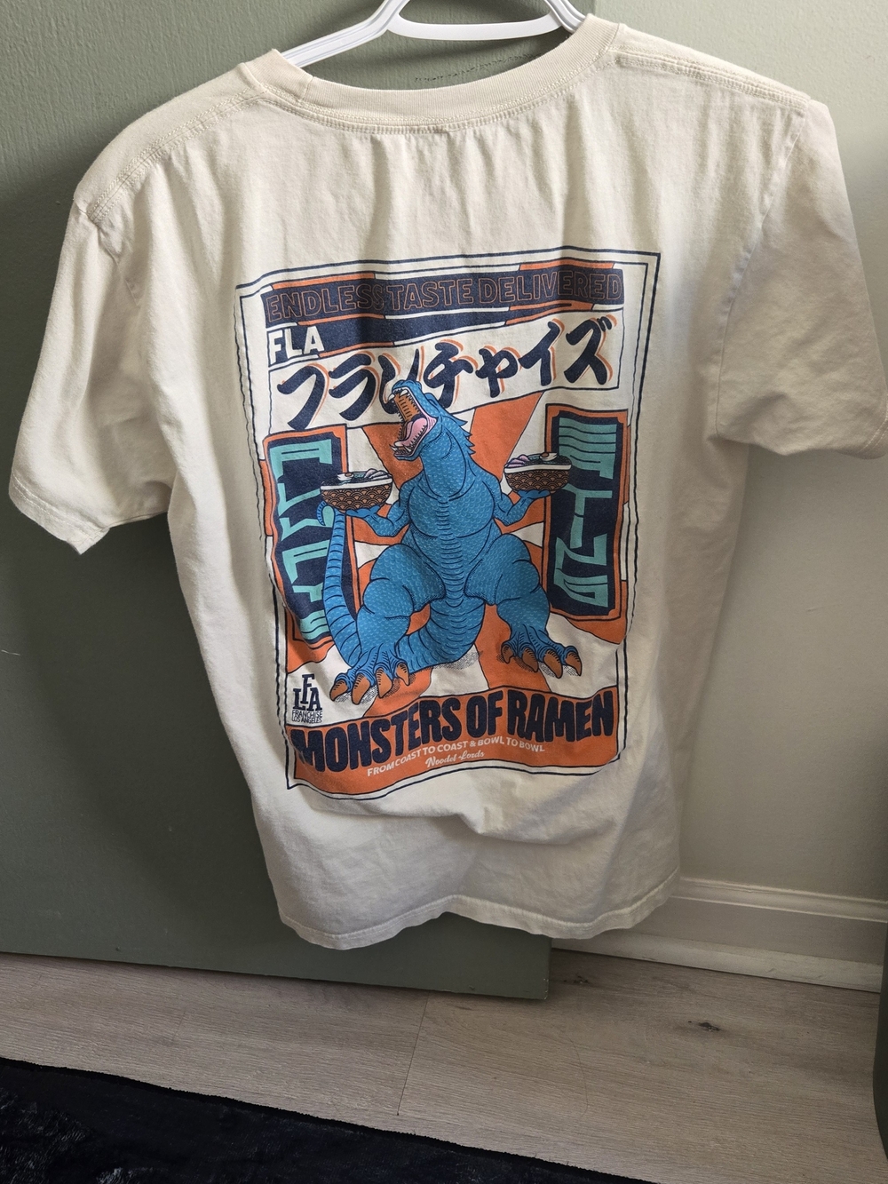 FLA Cream Graphic Crewneck Tee with Blue & Orange Print